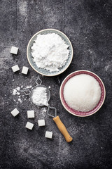 Sugar and powder on concrete background