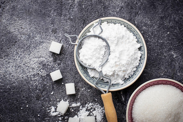 Sugar and powder on concrete background