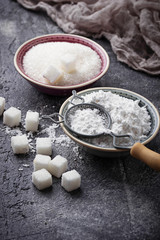 Sugar and powder on concrete background