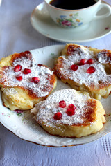 drop scones with pomegranate and icing sugar
