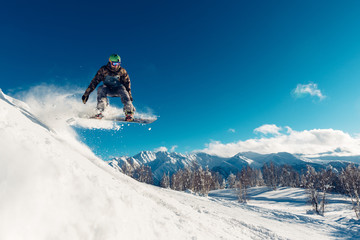 snowboarder is jumping with snowboard - obrazy, fototapety, plakaty