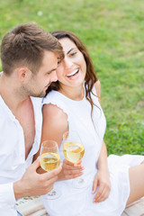 Obraz na płótnie Canvas Happy couple drink wine. Summer holiday idyllic.