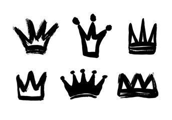 Set texture strokes thick paint in the form of a crown isolated on white background. Set of black hand drawn crowns.