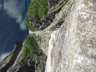 Extreme view sixhundred meters down from the Preikestolen to the bottom of the Lysefjord
