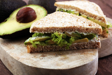 sliced avocado on toast bread with spices and avocado
