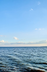 Obraz premium Beautiful sea, river, lake, reservoir. Ukraine, Dnepropetrovsk region, Nikopol city. Natural panorama in the rays of the setting, the rising sun. A magnificent blue sky with neat clouds. 