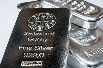 Several silver bars of different weight produced. Selective focus.