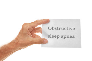 Old man hand holding sheet of paper on a white background