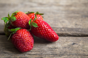 bunch of strawberries on wooden background