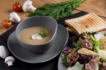 Cream soup with mushrooms, vegetables and bread crumbs. Diet vegetarian dishes, Italian cuisine.