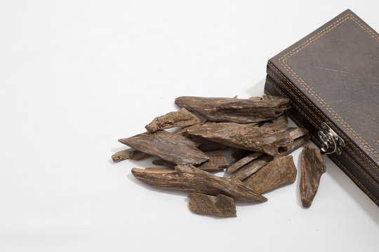 incense Chips, Agarwood, placed around a leather box, it's name in Arabic Oud Wood used to incense Cloths, furniture and places for occasions