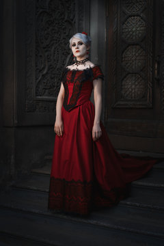 Woman in a gothic image in a fairy-tale castle, retro style.