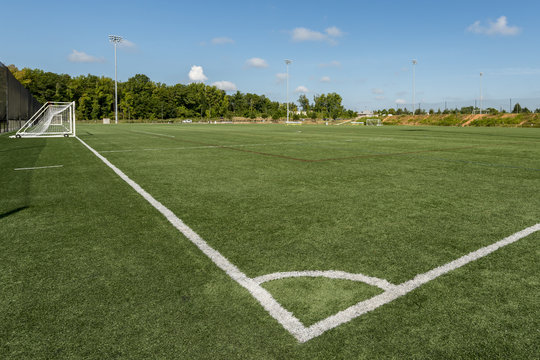 Soccer field background with a shallow depth of field on a beautiful summer day