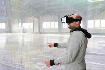 Architect with VR visor exploring industrial building environment