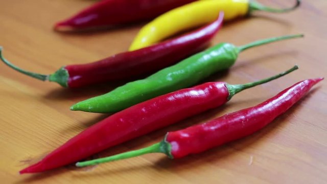 Hot chili peppers on a wooden table
