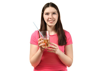 cute girl in pink dress holds a Cup of soda and a cocktail straw