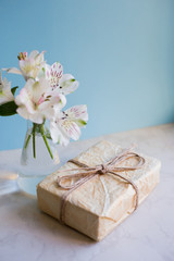 Fototapeta na wymiar Beautiful tender bouquet of Alstroemeria with parcel