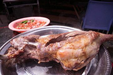 Grilled lamb meat with tomato salad and ugali,