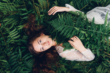 A girl in a fern