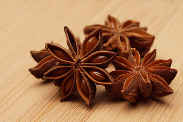 Star anise on wooden background