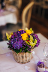 Flower compositions on the wedding table in rustic style. Wedding decorations with their own hands. Wedding in Montenegro.