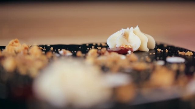 refocusing closeup shot of creamy stars of chocolate dessert in a restaurant