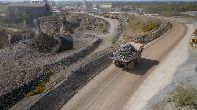 Mining Truck Carrying Ore to a Processing Plant in a Quarry