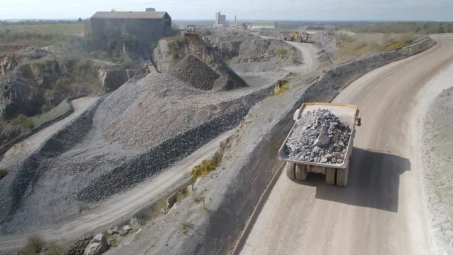 Mining Truck Carrying Ore to a Processing Plant in a Quarry