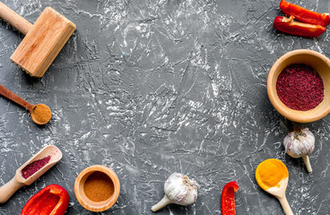 Professional kitchen with spices for cook on gray background top view mockup