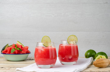 Watermelon fresh juice with mint leaves and lime citrus