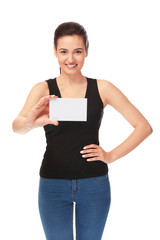 Beautiful young woman with business card on white background