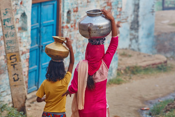 Vrindavan, 22 October 2016: Two women carrying jars on their head, in Vrindavan, UP