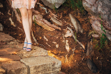 Female feet on a stone floor in Montenegro.