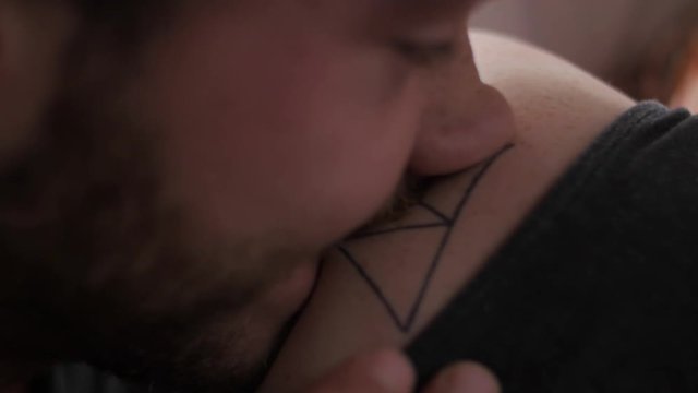 Young couple in bed playing with their bodies