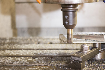 The CNC milling machine cutting the sample  part with the cutting tool