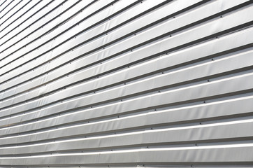 The texture of the wall is made of metal coating of huge aluminum plates of relief shape