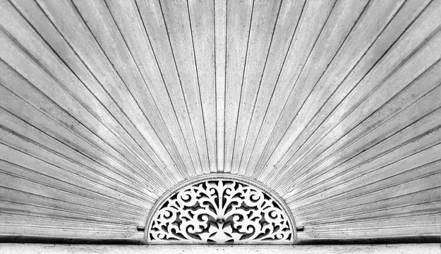 Wood carving pattern over the door of ancient Chinese style house at Trok Ban Chin, Tak province, Thailand