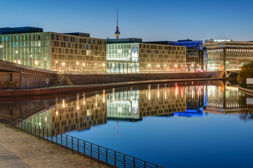 Office buildings at the river Spree in Berlin with the Television tower in the back