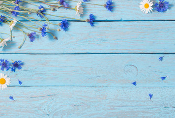 flowers over blue wooden background