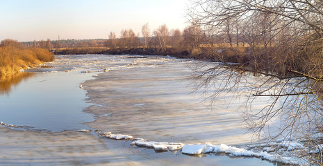 Panorama of Zhizdra River valley with spring ice drifting at early morning before dawn. Bulatovo, Kaluzhskaya region, Russia.
