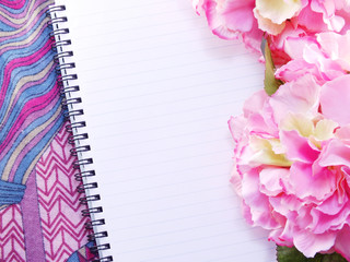 blank notebook with bouquet of flower vintage filters background