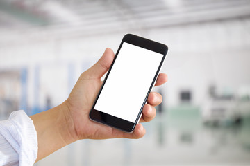 Man using smartphone over blurred garage car service center background. For Graphic design montage.