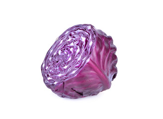 whole and cut fresh red cabbage on white background