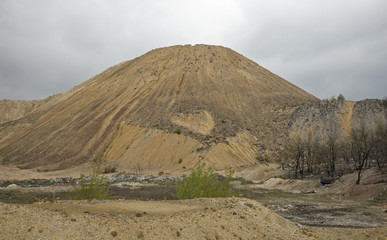 Red artificial lake and hills