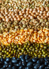 Cereals background: chickpeas, peas, lentils, green buckwheat, black beans, sesame seeds.