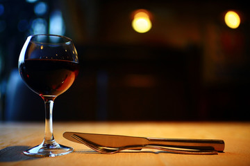 Serving a glass of red wine in a restaurant