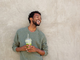 handsome african american man with healthy smoothie