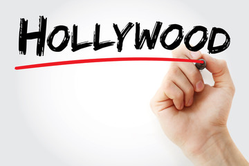 Hand writing Hollywood with marker, concept background
