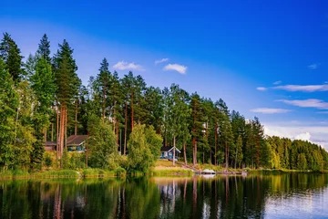 Foto op Plexiglas Wooden log cabin at the lake in summer in Finland © nblxer