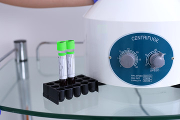 Researcher performs blood centrifuging